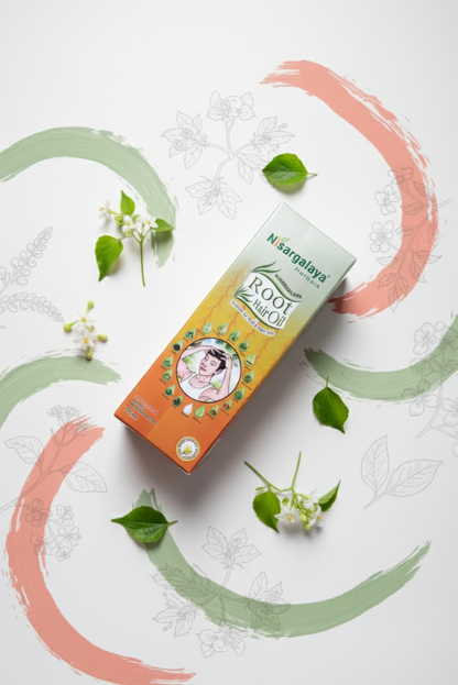 Nisargalaya Root hair oil product packaging on a decorative background with green leaves and floral elements.